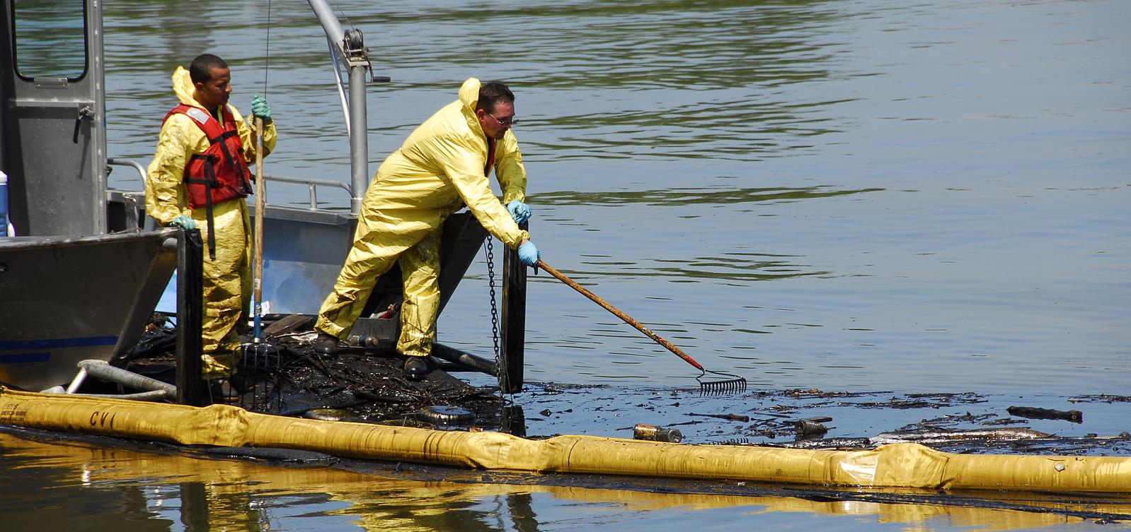 Workers clean up oil spill